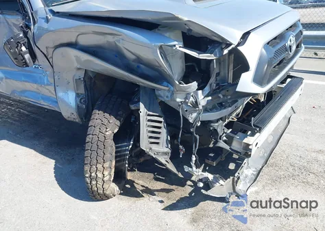 2015 Toyota Tacoma Base V6 z USA, uszkodzony, nr VIN 3TMLU4EN1FM185873